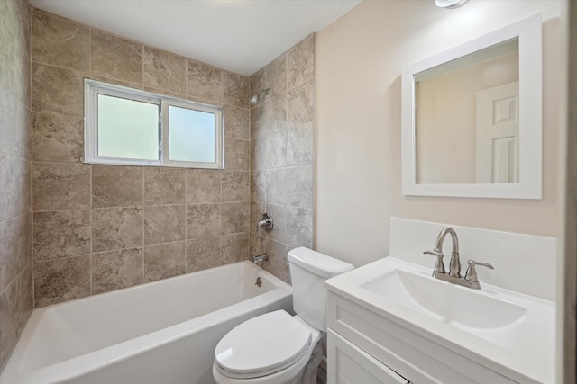 full bathroom with vanity, toilet, and tiled shower / bath