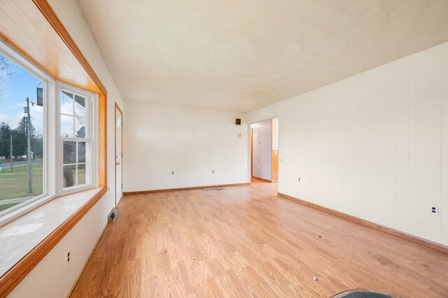 unfurnished room featuring light wood-type flooring