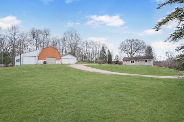 view of yard with an outbuilding and a garage