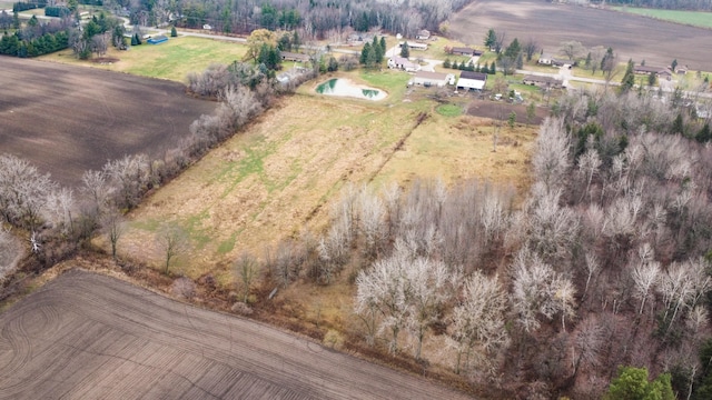 birds eye view of property featuring a rural view