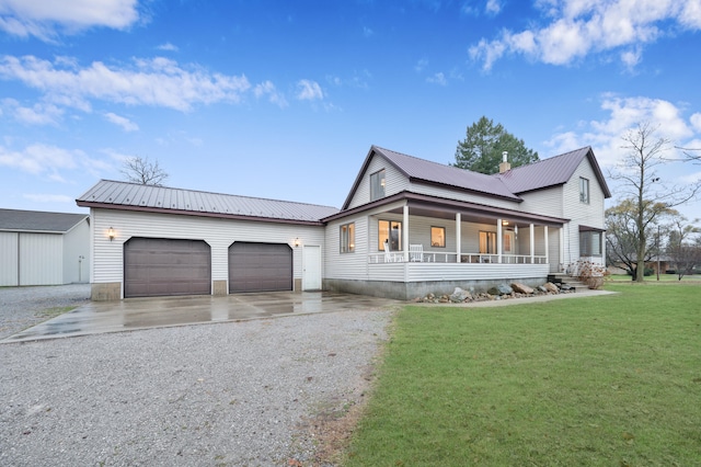 view of front facade with a front lawn, a porch, and a garage