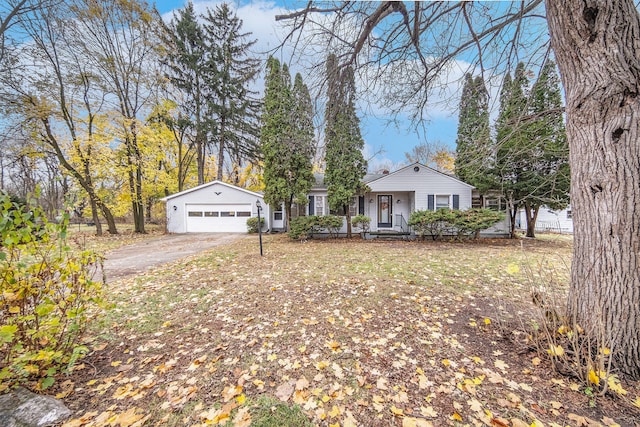 single story home with a porch and a garage