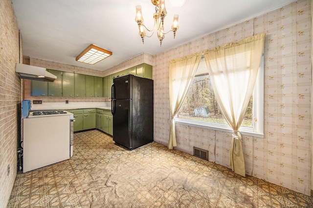 kitchen with white electric range oven, black fridge, ventilation hood, a chandelier, and green cabinetry