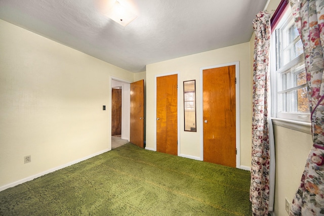 unfurnished bedroom with carpet flooring