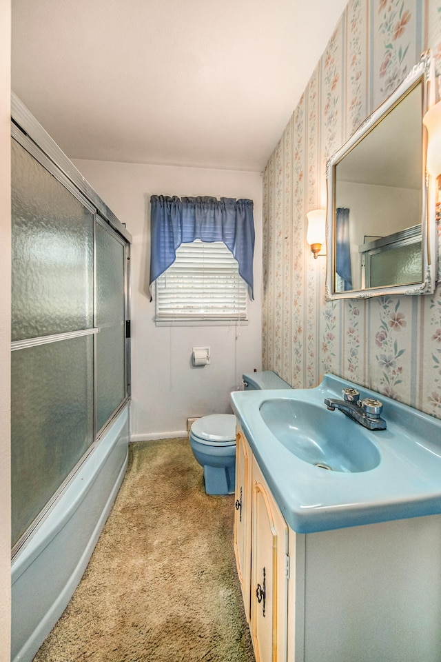 full bathroom with vanity, toilet, and enclosed tub / shower combo