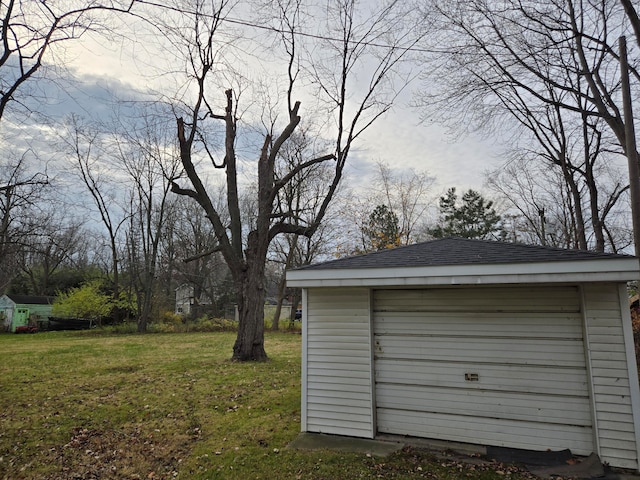 garage with a lawn