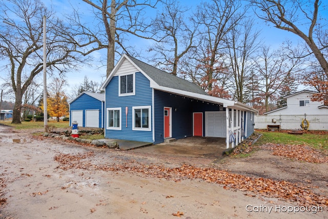 exterior space featuring a carport and a garage