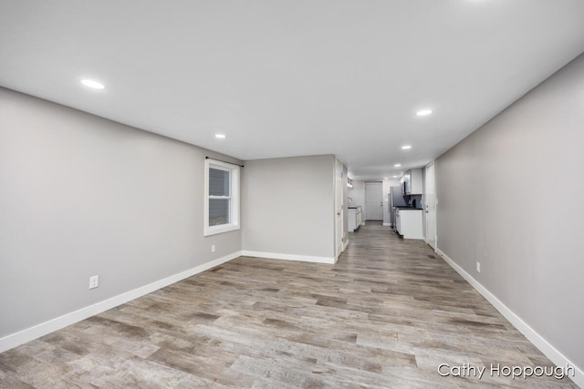 unfurnished living room with light wood-type flooring