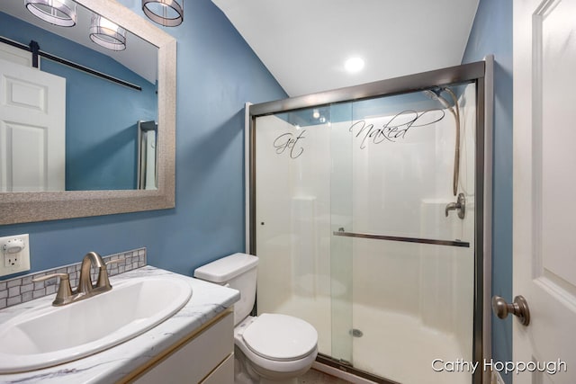 bathroom featuring tasteful backsplash, vanity, an enclosed shower, and toilet