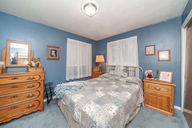 bedroom featuring light colored carpet