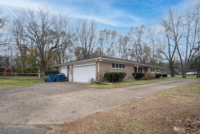 ranch-style home featuring a garage