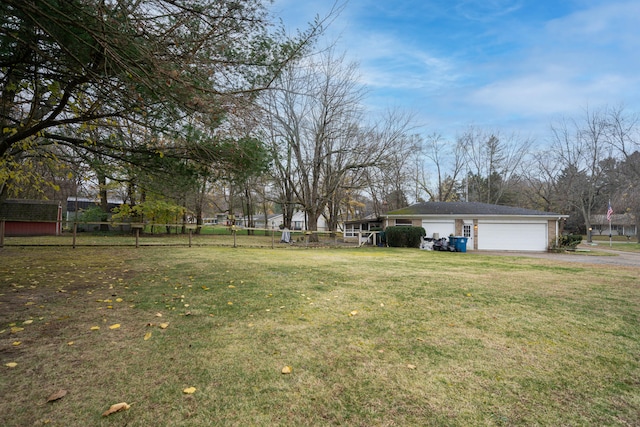 view of yard with a garage