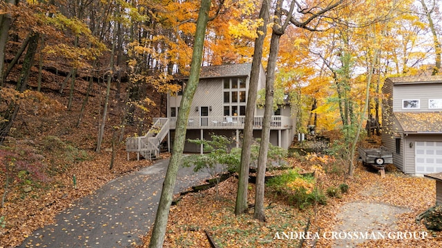 view of front of property with a garage and a wooden deck