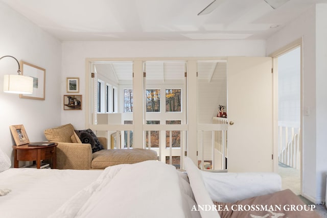 carpeted bedroom with multiple windows and ceiling fan