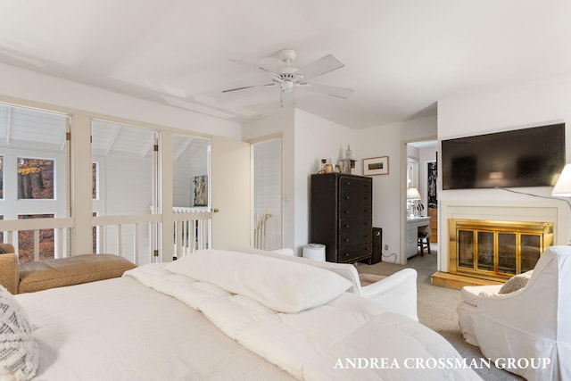 bedroom featuring light colored carpet and ceiling fan