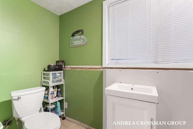 bathroom featuring vanity and toilet