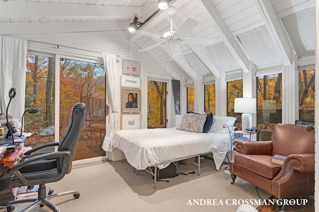 bedroom featuring ceiling fan and lofted ceiling with beams