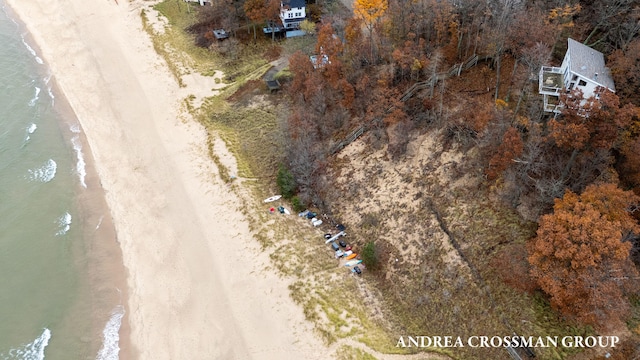 bird's eye view featuring a water view and a view of the beach