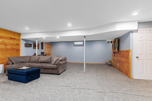 carpeted living room featuring a wall mounted air conditioner and wood walls