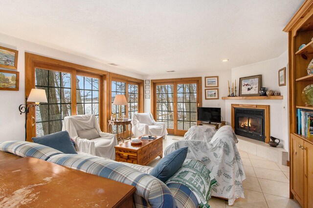 tiled living room featuring plenty of natural light