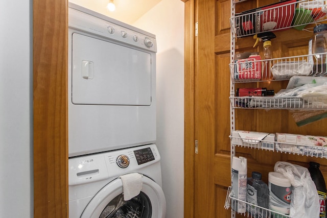 laundry room featuring stacked washer and clothes dryer