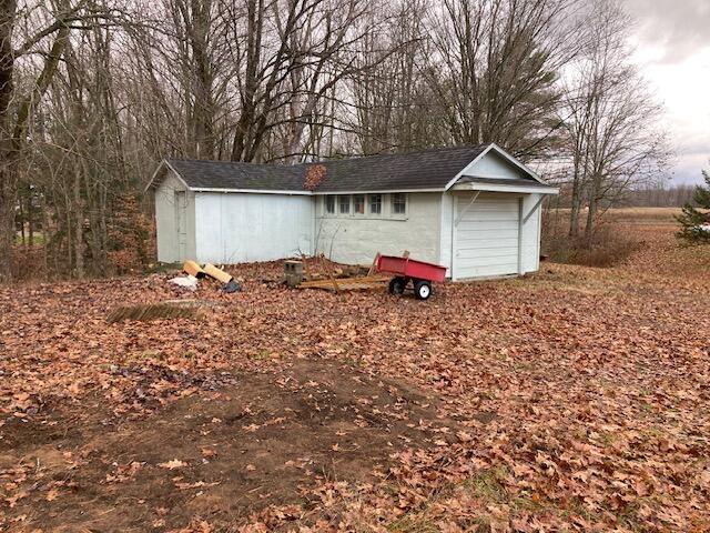 view of outbuilding featuring a garage