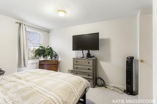 carpeted bedroom with a textured ceiling