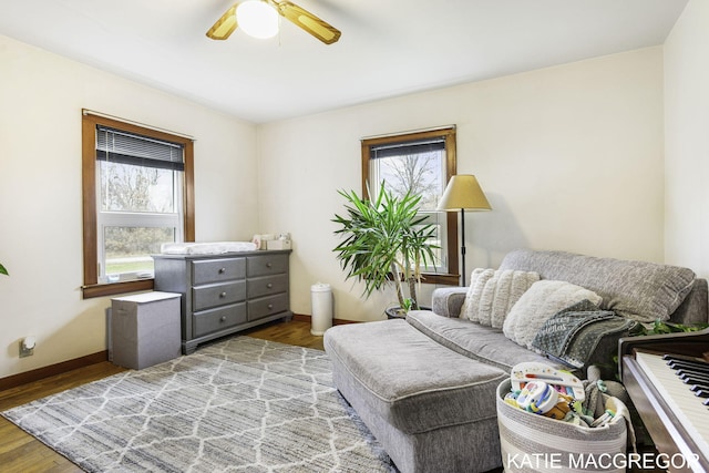 living area featuring ceiling fan and light wood-type flooring