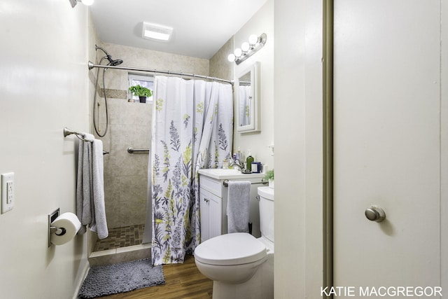 bathroom featuring vanity, toilet, a shower with shower curtain, and hardwood / wood-style flooring