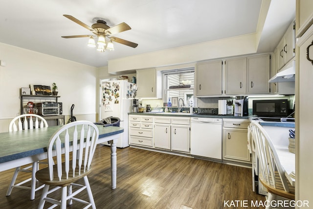 kitchen featuring ceiling fan, sink, dark wood-type flooring, and white appliances