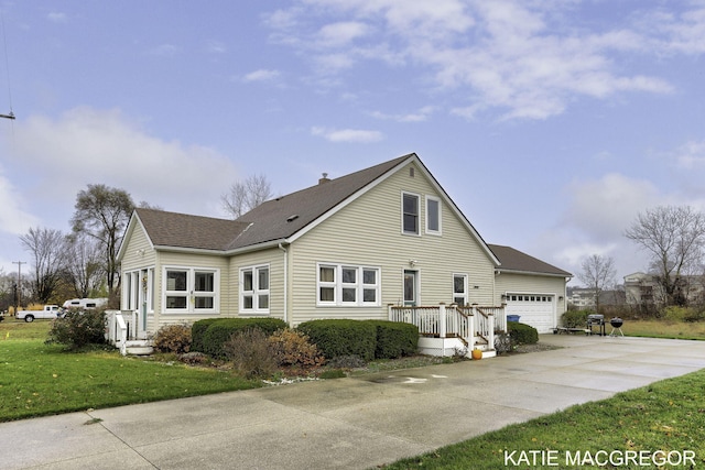 exterior space with a garage and a lawn