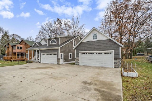 18481 N Fruitport Rd, Spring Lake, MI 49456 - view of front of property featuring stone siding and concrete driveway