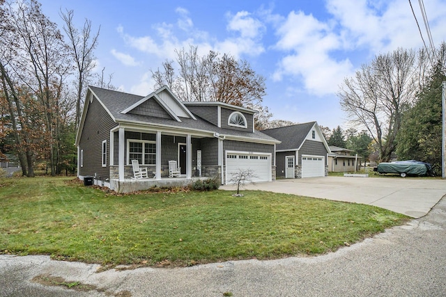 18481 N Fruitport Rd, Spring Lake, MI 49456 - view of front of property with covered porch, driveway, a front yard, and a garage