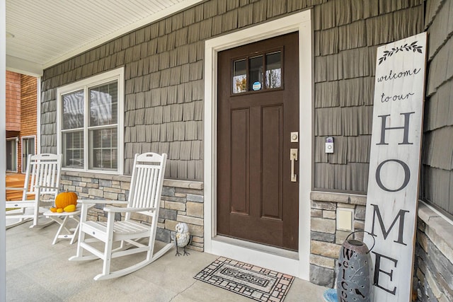 18481 N Fruitport Rd, Spring Lake, MI 49456 - property entrance featuring a porch and stone siding