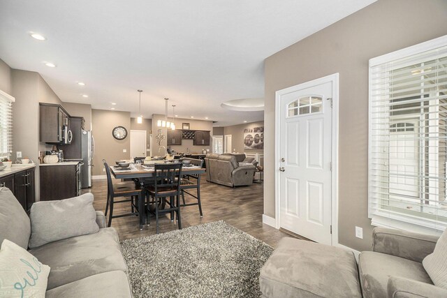 18481 N Fruitport Rd, Spring Lake, MI 49456 - living area with baseboards, dark wood-style floors, and recessed lighting
