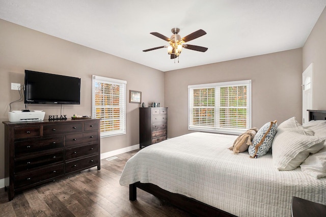 18481 N Fruitport Rd, Spring Lake, MI 49456 - bedroom featuring dark wood-style floors, baseboards, and ceiling fan