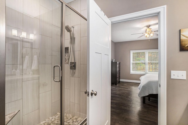 18481 N Fruitport Rd, Spring Lake, MI 49456 - bathroom featuring ensuite bathroom, a stall shower, a ceiling fan, and wood finished floors