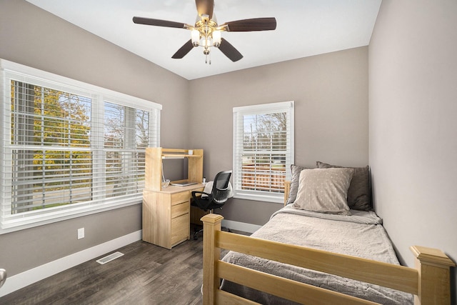 18481 N Fruitport Rd, Spring Lake, MI 49456 - bedroom with dark wood-type flooring, baseboards, and a ceiling fan