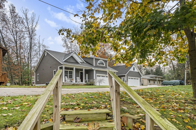18481 N Fruitport Rd, Spring Lake, MI 49456 - view of front of house with a porch and a garage