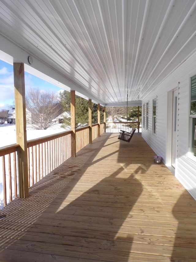 view of snow covered deck