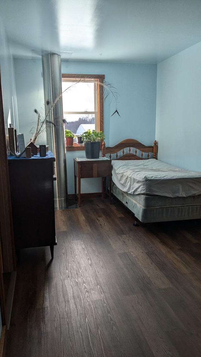 bedroom featuring dark wood-type flooring