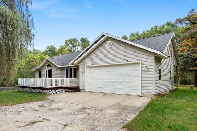 single story home with a garage and a deck