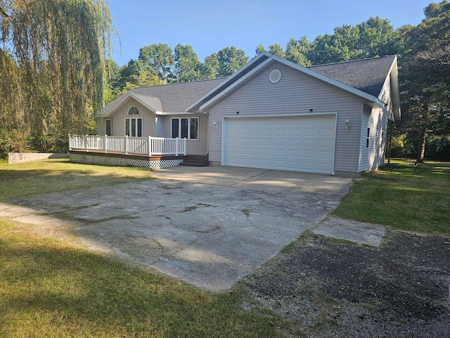 ranch-style house featuring a wooden deck, a front lawn, and a garage