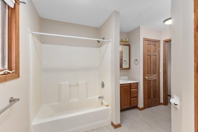 bathroom with shower / bathing tub combination and vanity