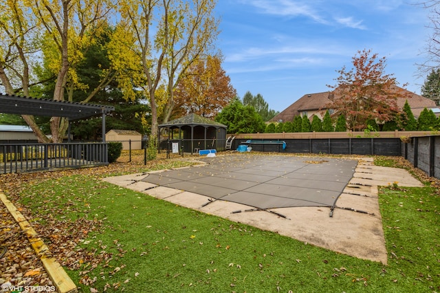 view of pool with a gazebo and a yard