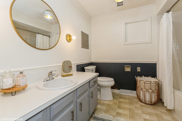 full bathroom with crown molding, vanity, shower / bath combo, and toilet