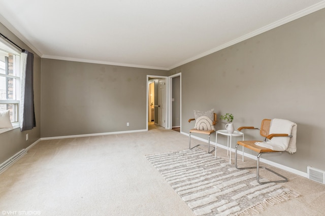 unfurnished room featuring crown molding, baseboard heating, and light carpet