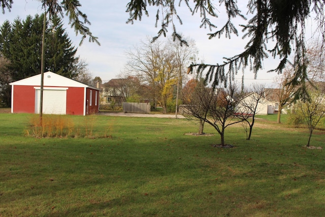 9370 Moon Rd, Saline, MI 48176 - view of grassy yard with an outdoor structure and a garage