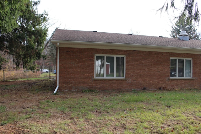 view of property exterior featuring a lawn