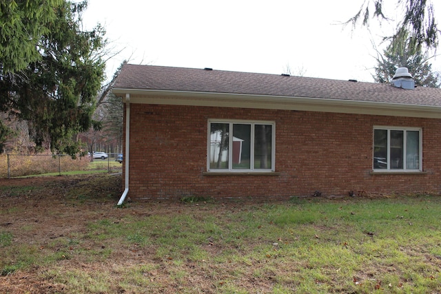 9370 Moon Rd, Saline, MI 48176 - view of property exterior with brick siding, roof with shingles, and a chimney